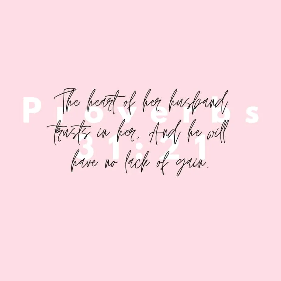 A pink background with Proverbs 31:21 written in a white background font and the verse quoted in black script in front of it