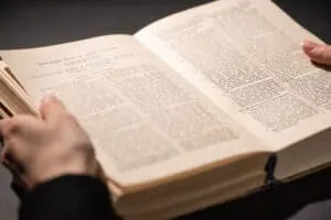 Person reading Bible; Christian friendship praying