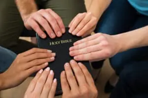 People Holding Holy Bible, Christian friendship