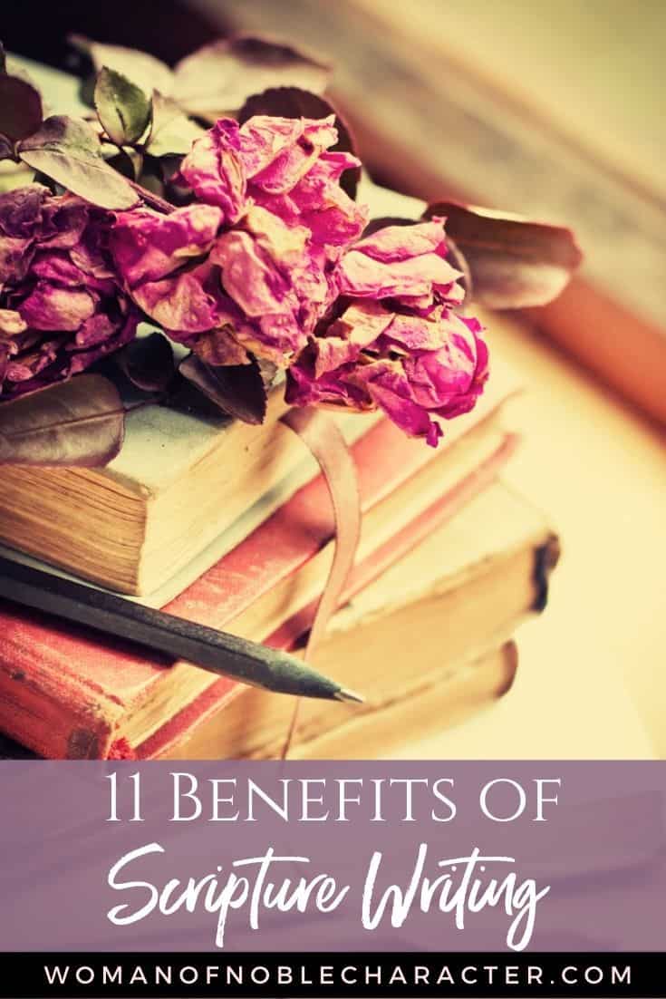 books with dried flowers and pen; benefits of writing scripture