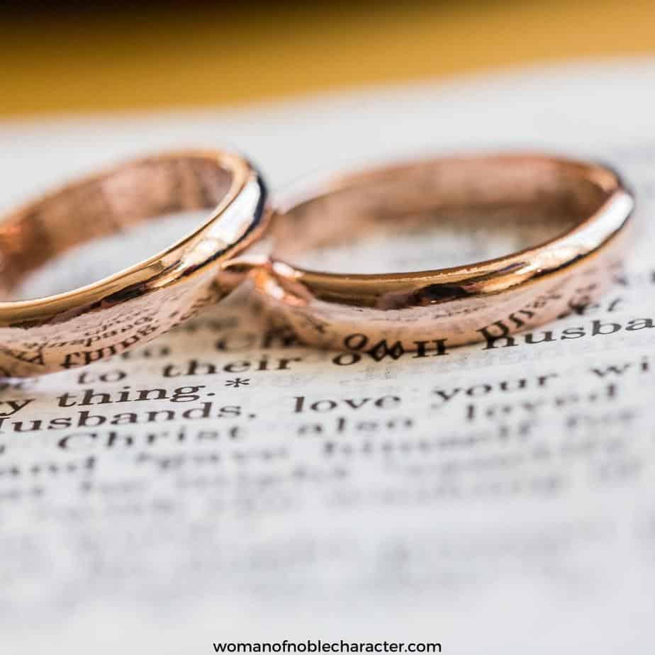 image of golden wedding rings over open Bible for the post Why A Christ Centered Marriage May Not Be What You Think It Is