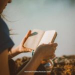 image of woman with open Bible for the post Bible Journaling: What It Is, How To Start And The Benefits Of