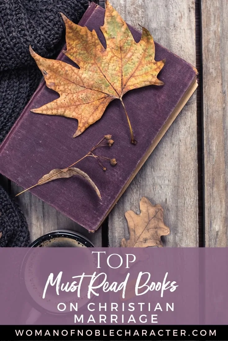 An image of a purple book on a wooden table with maple leafs on and around it and a gray sweater next to it - Books on Christian Marriage