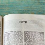 image of the bible opened to the book of ruth links to post the story of ruth and Naomi