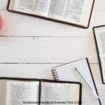 image of Bibles and journals open on white background for the post The Ultimate List of Best Bible Study Tools