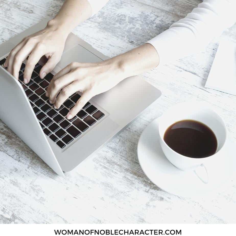 image of woman typing on laptop with coffee cup nearby for the post Logos 8: The ULTIMATE Bible Study Resources for Serious Students of God's Word