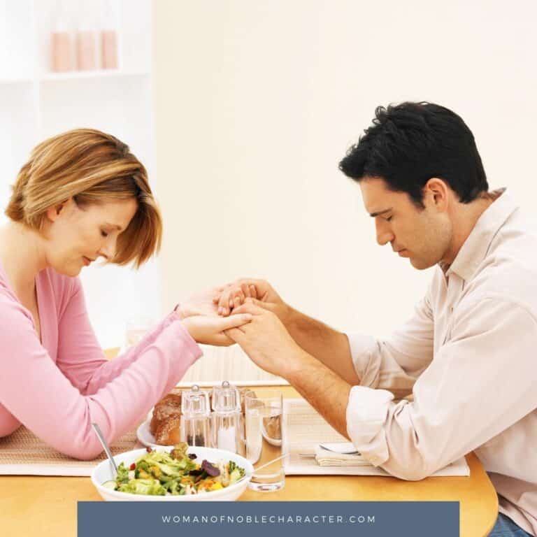 image of man and woman in prayer at the dinner table for the post What Does It Mean To Be A Submissive Wife
