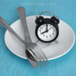 image of fork and knife plus clock on white dinner plate and blue surface for the post Add Prayer and Fasting for Marriage Blessing