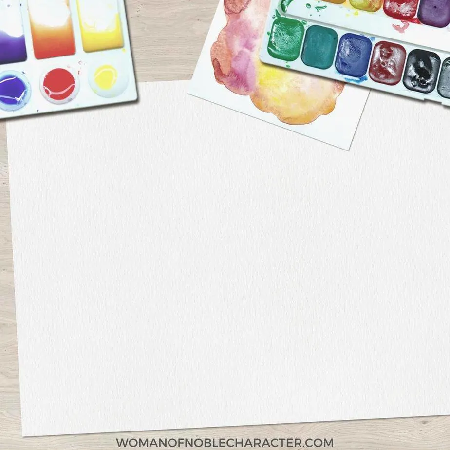 image of large sheet of white paper and watercolor paints for the post Techniques For Bible Journaling For Free or Inexepensively