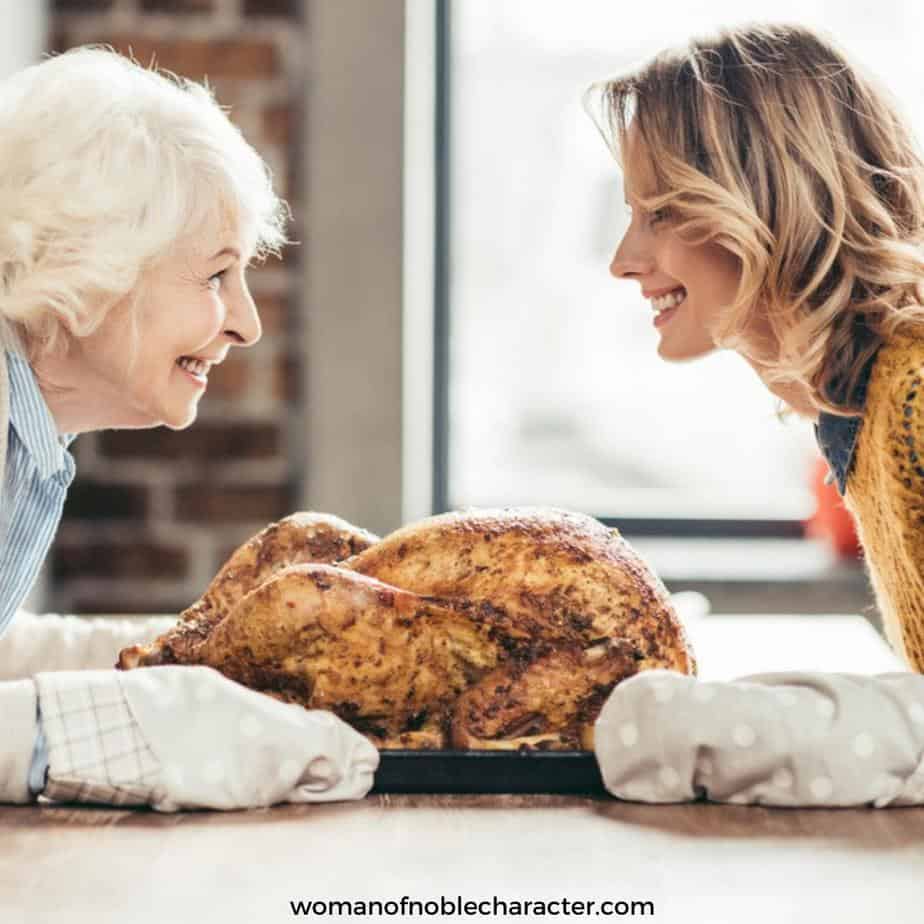 image of older woman teaching younger woman how to cook a turkey for the post Titus 2 Discipleship: Training Up Godly Women for His Kingdom