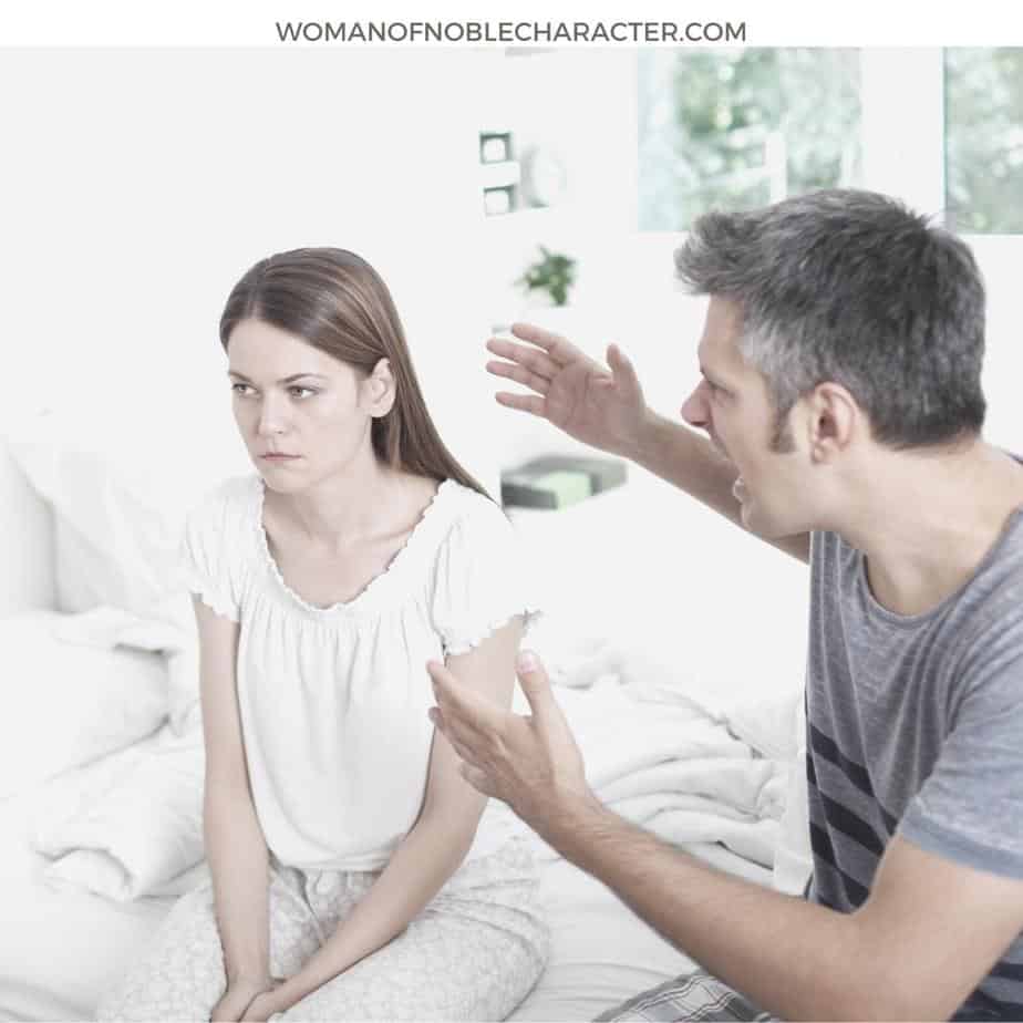 image of husband yelling at wife while both are sitting on white bed for the post What if My Husband Doesn't Deserve a Proverbs 31 Wife?