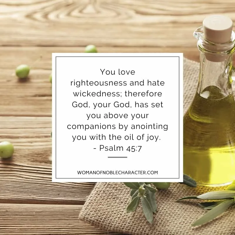 An image of olives on a wooden table with a decanter of olive oil and Psalm 45:7 quoted
