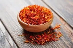 Saffron in wooden bowl, spices in the Bible and their uses