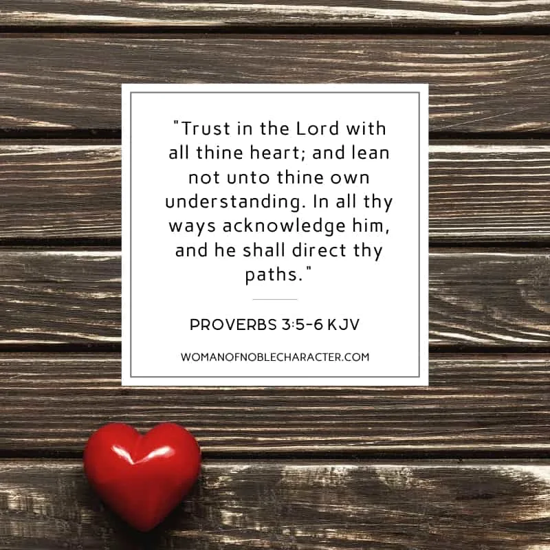 An image of a red heart on a wooden table with the quote, ""Trust in the Lord with all thine heart; and lean not unto thine own understanding. In all thy ways acknowledge him, and he shall direct thy paths." from Proverbs 3:5-6 KJV