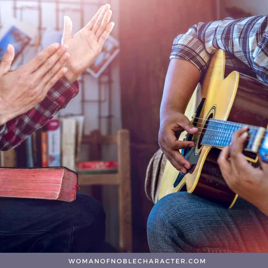 image of man playing guitar in church while another claps with Bible on his lap for the post Sing Joyful Noise - God's Commandment for Music as Worship