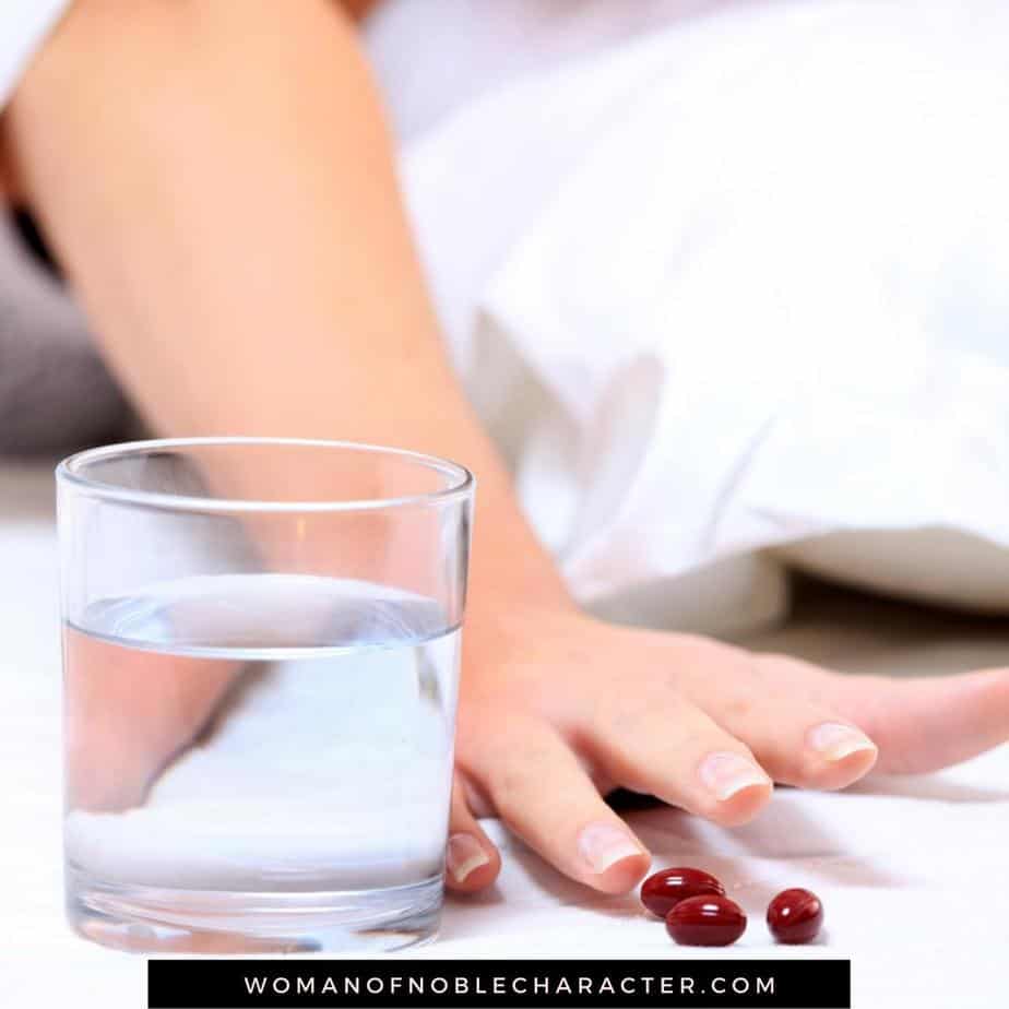 image of woman in bed reaching for pills and glass of water for the post God and Cancer: How God is Fighting My Battle with Cancer