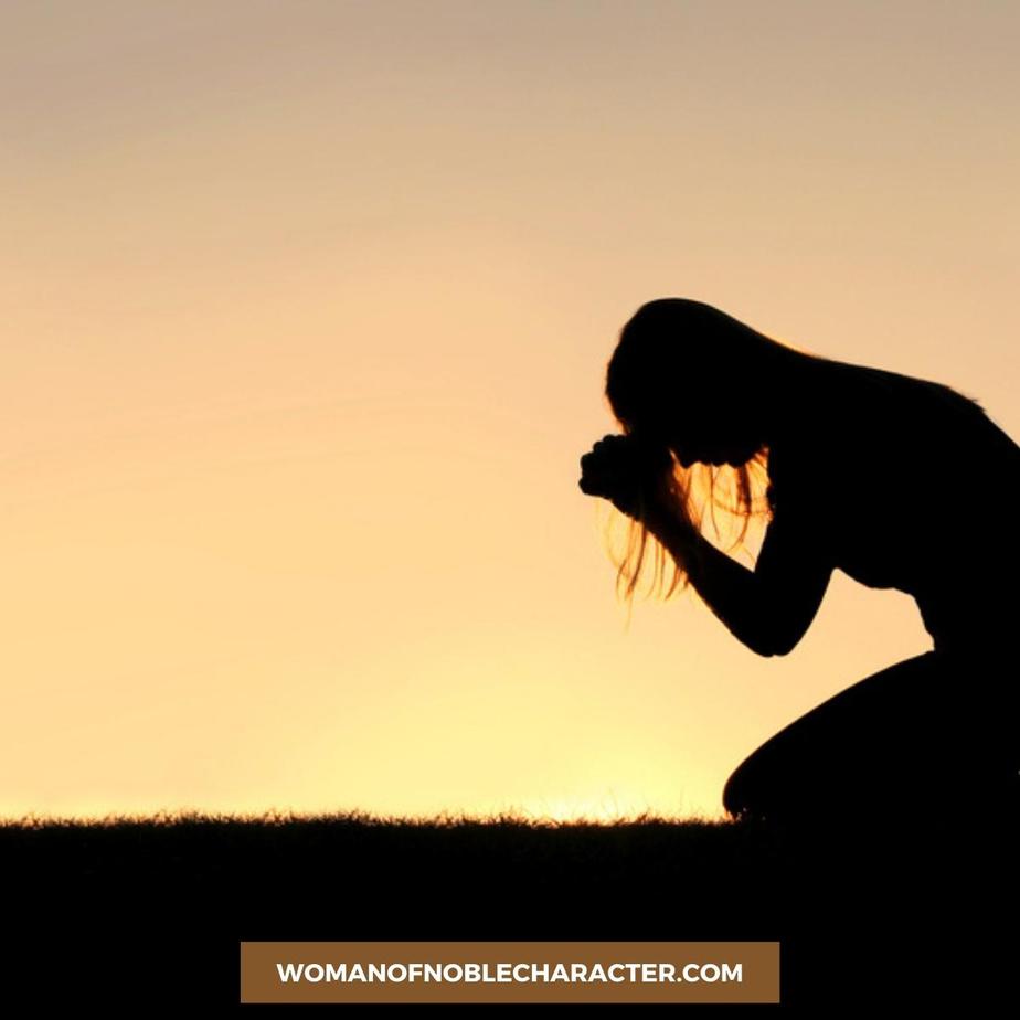 image of woman kneeling in prayer at sunset for the post What it Means to Abide in Him and 4 Steps to Abiding