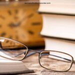 image of eye glasses and clock near open Bible for the post The SOAP Bible Study Method: 4 Simple Steps to Understanding God's Word