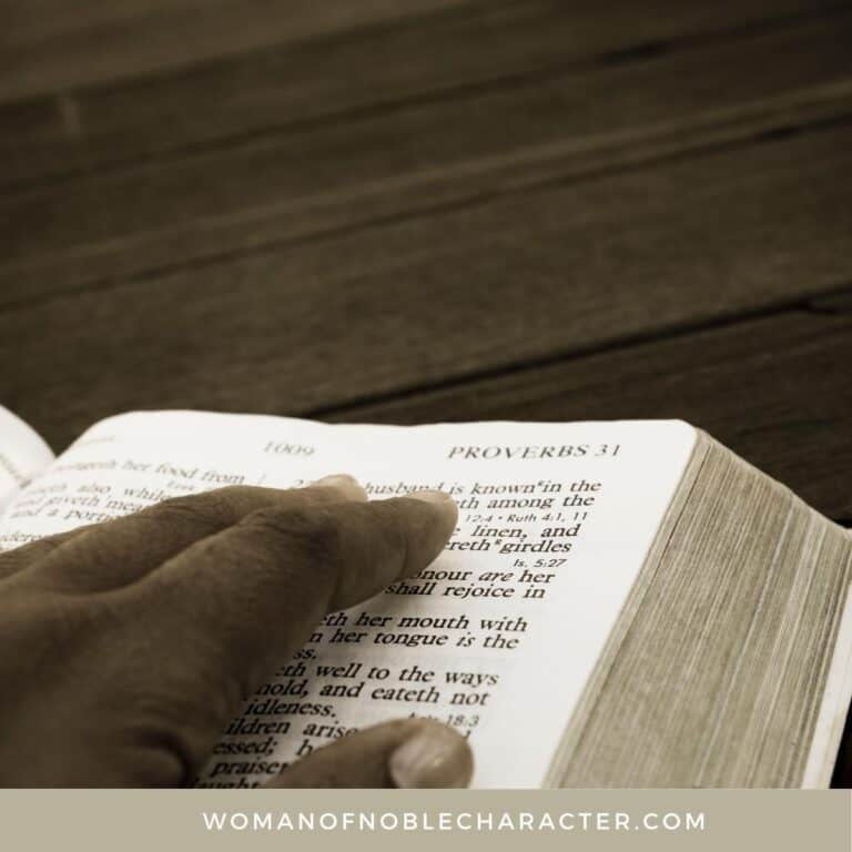 image of woman's hand skimming open Bible for the post How to Find Strength as a Proverbs 31 Woman