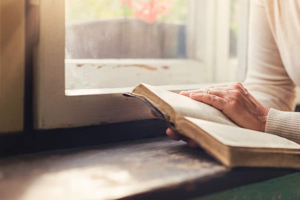 image of person holding an open bible