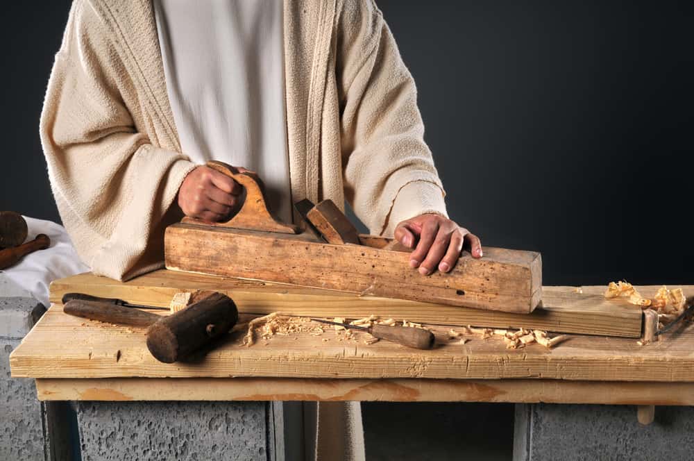 image of man working with wood and tools