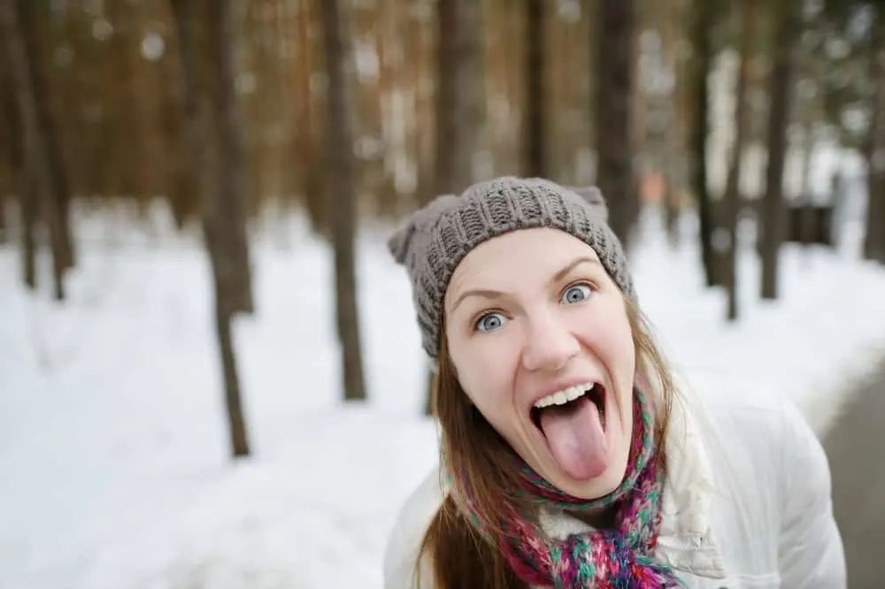 image of a woman being silly outside in winter 

