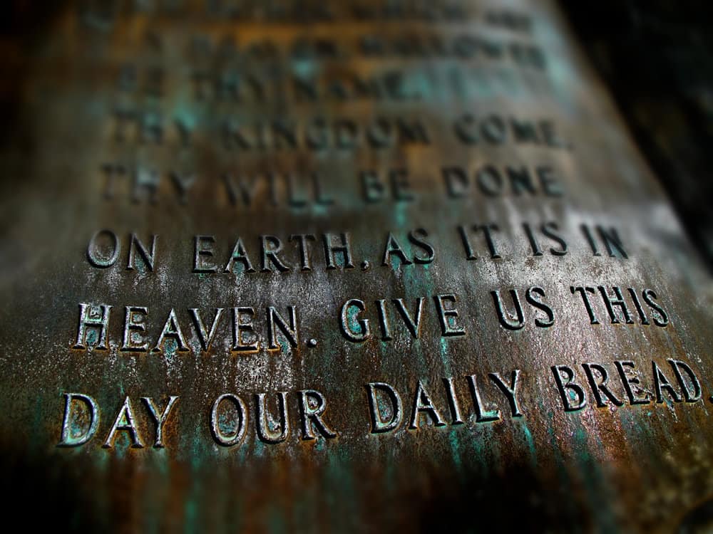 image of Sculpture of the Lord's Prayer with scriptures from Bible for the post on communion prayer