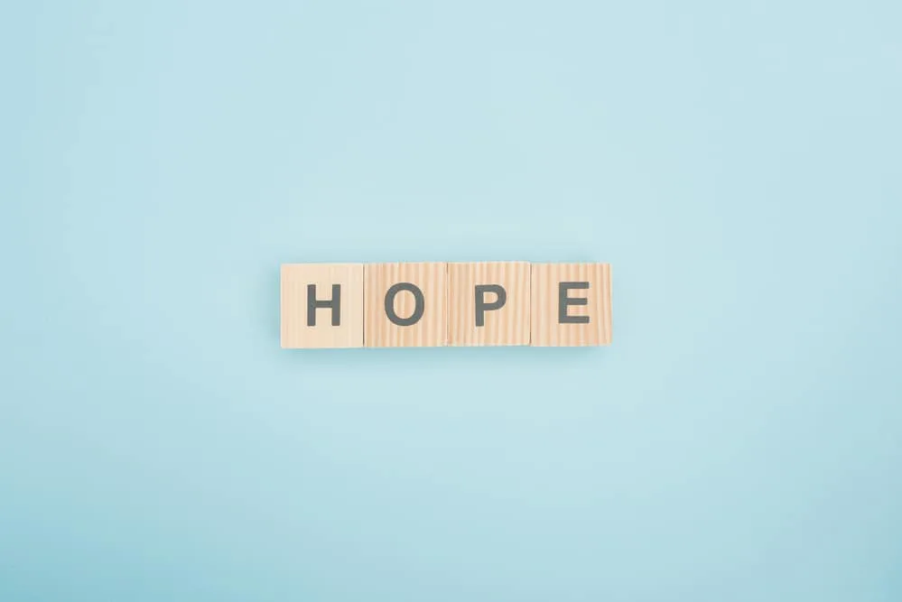 image of scrabble tiles spelling "hope" on blue background for the post Obey God rather than man