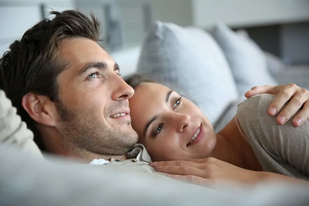 image of couple cuddling in bed for the post on sex in a Christian marriage and Christian sex