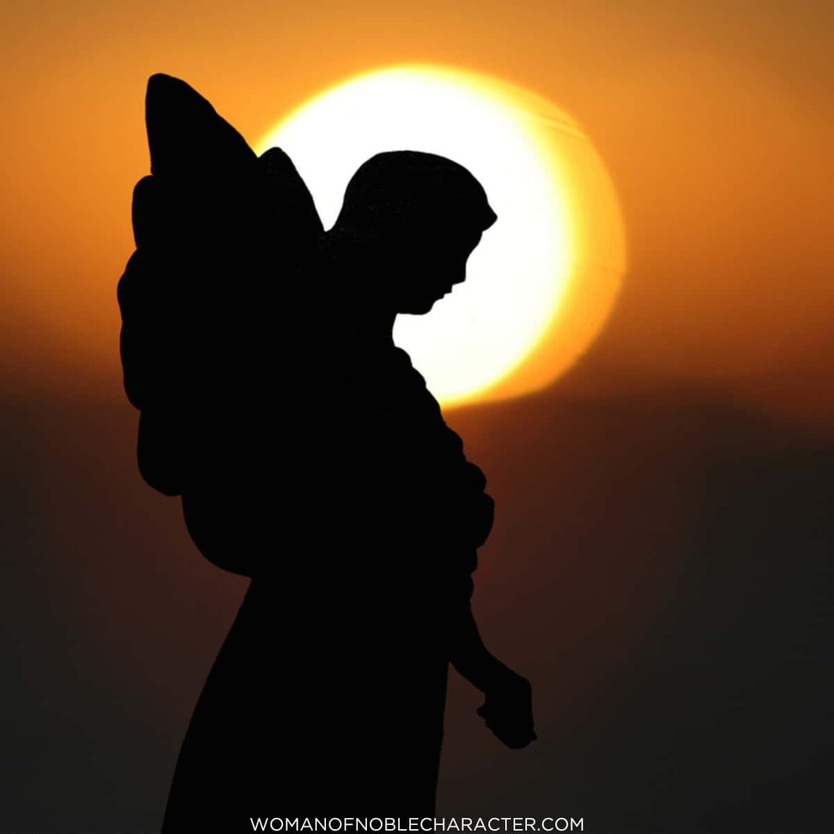 image of angel in front of sunset for the post on the angel of the Lord