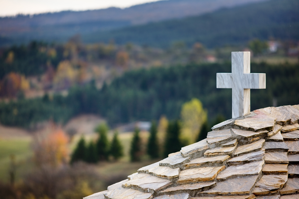 image of cross on roof for faith in action post