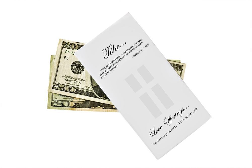 image of money and collection envelope for the post on what the Bible says about tithing