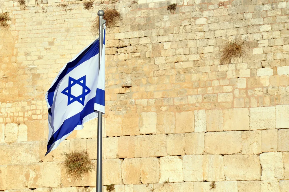 flag of Israel near western wall for the post on prayers for Israel