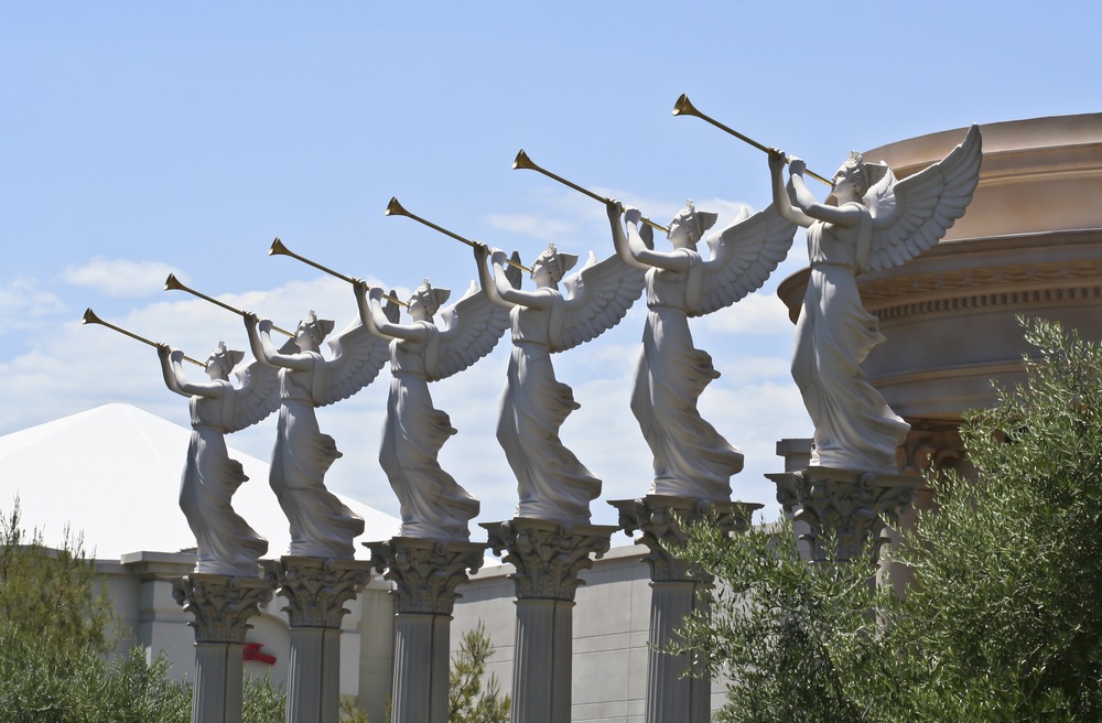 photo six marble statues on columns of angels blowing trumpets for the post on the seven trumpets in the Bible